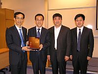 The delegation presents a souvenir to Prof. Dennis Ng, Associate Pro-Vice-Chancellor of CUHK (The 2nd from left)